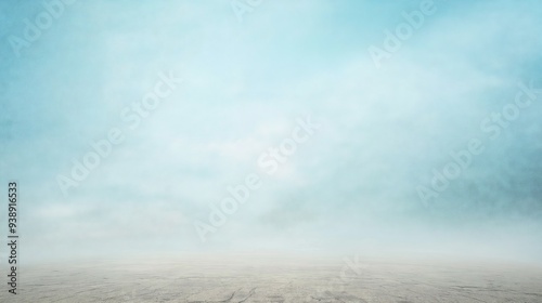 Foggy Desert Landscape Under a Soft Blue Sky
