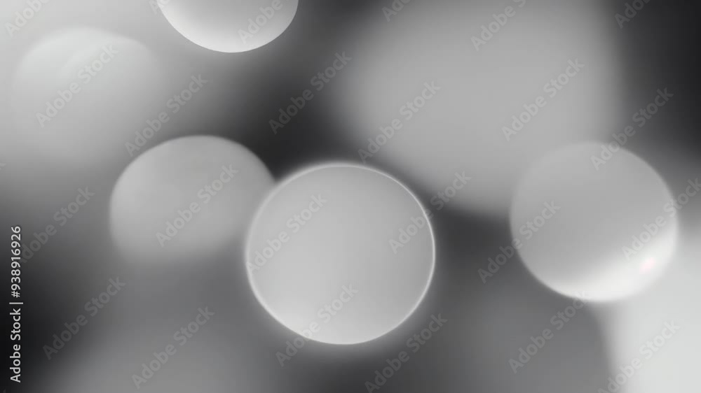 Blurred black and white abstract Christmas (Xmas) or New Year 4k video bokeh of blinking defocused holiday lights on dark background Blurred black and white abstract Christmas (Xmas) or New Year 4k video bokeh of blinking defocused holiday lights on dark background