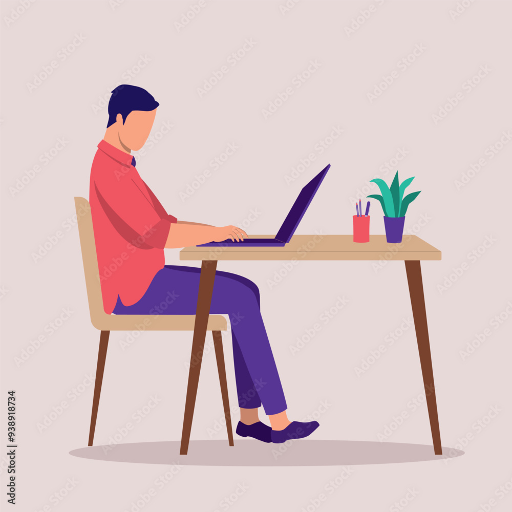 Side View Of A Young Man Working At A Desk With Laptop. Side View Of A Young Man Working At A Desk With Laptop.