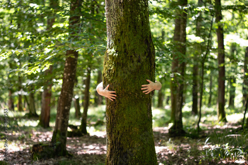 Woman hug the tree with love