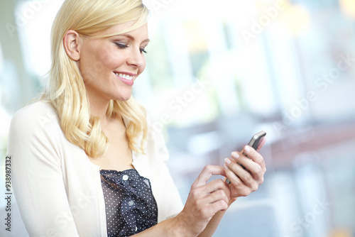 Business woman, phone and smile for networking, website and online application in office on internet. Employee, smartphone and communication for company project, message or kpi tools app in workplace