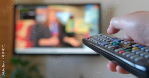 Men watching television in the living room. Viewing the television series at home. The choice of TV channel