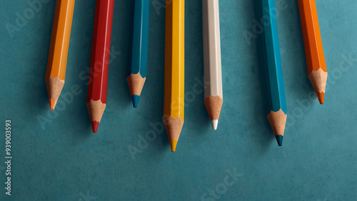 colored pencils on a blue background