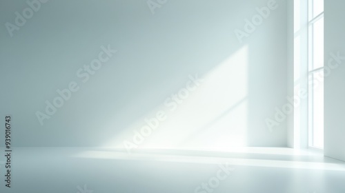 A large, empty room with a window in the corner