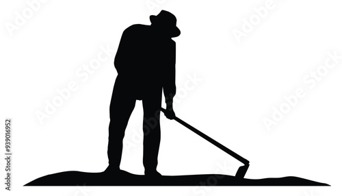 Silhouette of farmer hoeing the soil