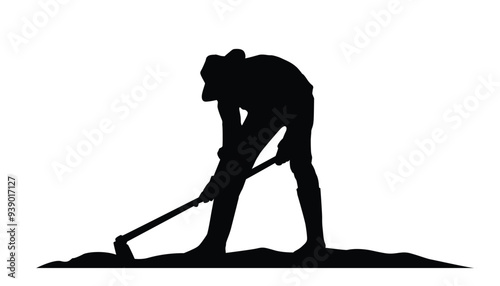 Silhouette of farmer hoeing the soil