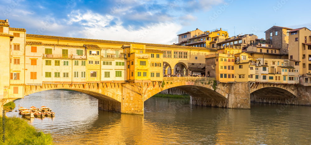 Panorama of the historic Ponte Vecchio bridge over the Arno river in Florence, Italy