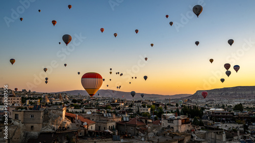 Hot air balloons flying above Goreme, Cappadocia, Turkey at dawn