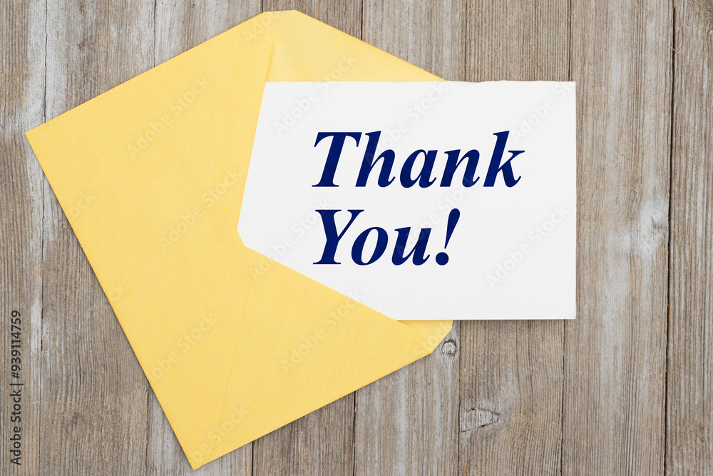 Thank you card with a envelop and pen on wood Thank you card with a envelop and pen on wood