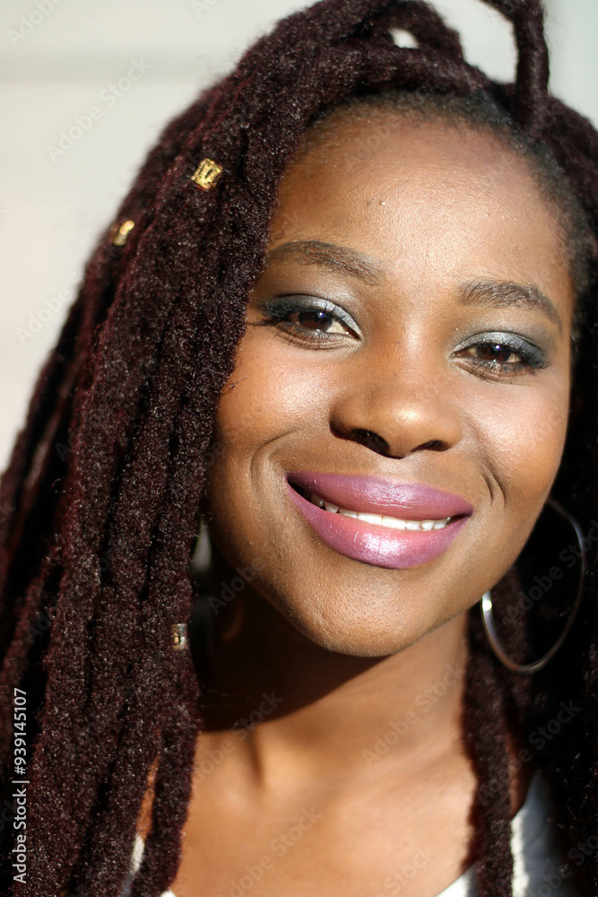 portrait of a young African woman with brown dreadlocks and make-up portrait of a young African woman with brown dreadlocks and make-up