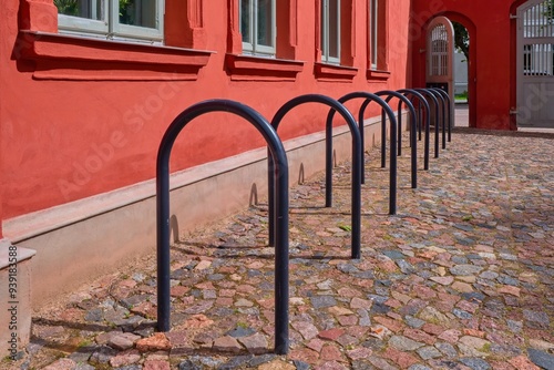 Equipped bike rack. Empty row of bike parking in a public place, urban infrastructure.