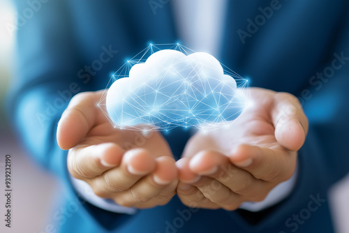 A businessman holding a cloud with digital connections, against a background 