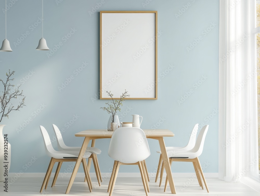 A white framed picture hangs on a blue wall