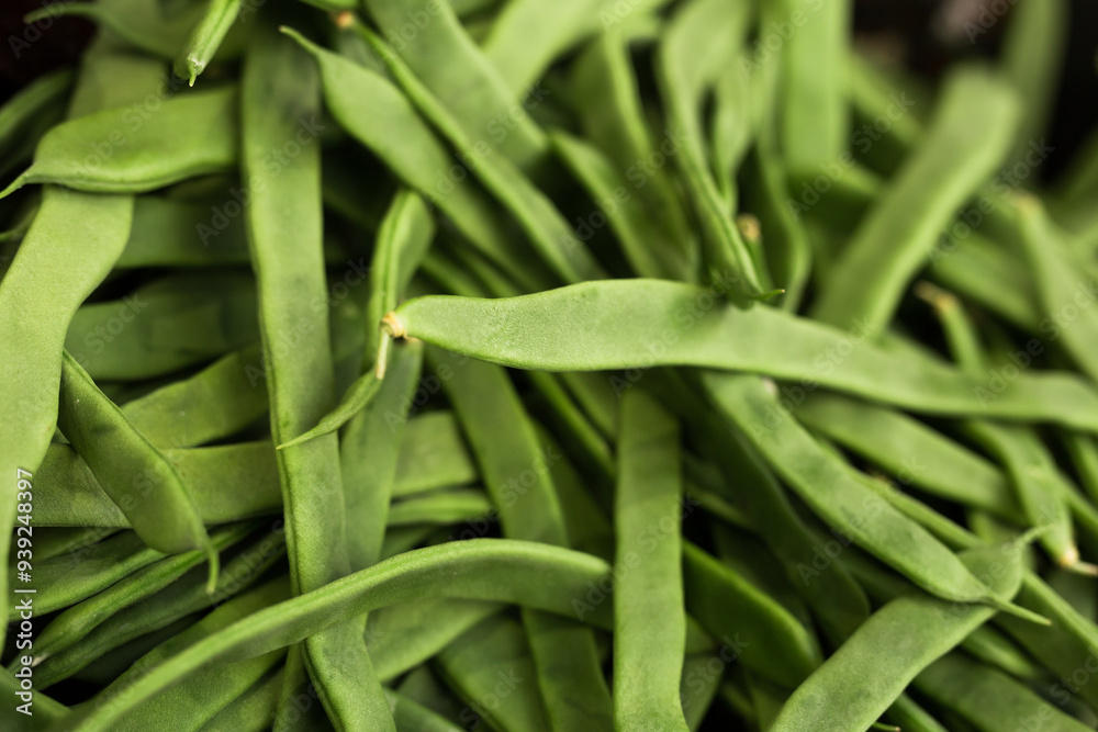 Green romano beans on the counter in the market Green romano beans on the counter in the market