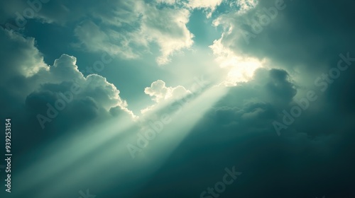 Fototapeta Naklejka Na Ścianę i Meble -  Sunbeams Shining Through Clouds in a Teal Sky