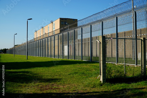 High security fence with spiky Nato wire rolls on top at a German prison in Hanover, Lower Saxony, Germany. Barbed wire to stop prisoners from escaping.