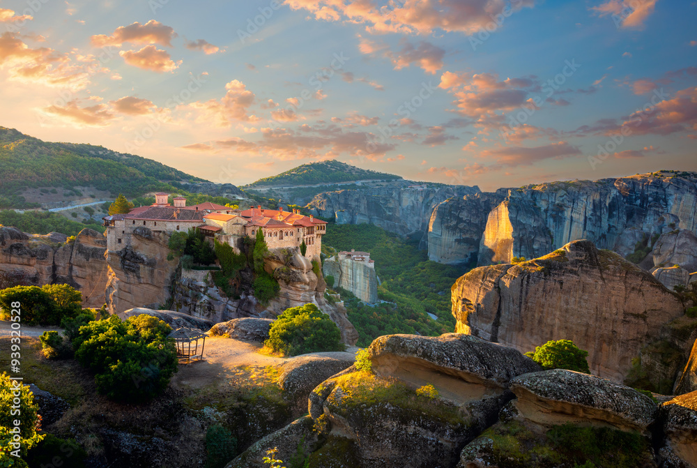 Meteora. Greece, Meteora Monasteries. Panoramic view of the Holy Monastery of Varlaam, located on the edge of a high cliff. Beautiful sunrise. Greece, Europe