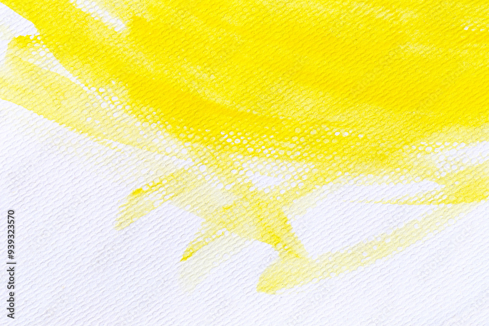 Yellow watercolour paint brush on the white art paper background.