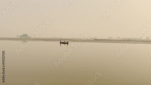 boat floating in the river | boat in the river | river bank | fisherman with his boat | ghaghra river  photo