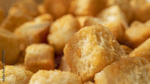 Macro shot of wheat croutons. Crunchy butter-flavoured croutons close-up.