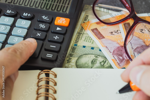 Obraz na płótnie Financial settlements in Indian rupees, Financial analysis, Tax calculation, Risk costs, business project. India money, close up. w salonie