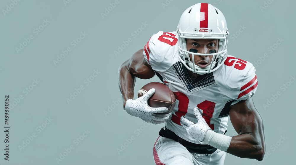 Athletic football player in action, showcasing determination and strength while running with football. Athletic football player in action, showcasing determination and strength while running with football.