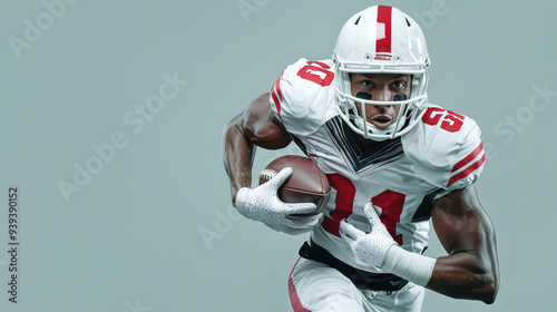 Athletic football player in action, showcasing determination and strength while running with football. 