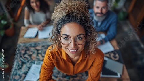 Wallpaper Mural A group of business professionals gathered in an industrial loft office, hands on the desktop, radiating cheerful energy and confidence Torontodigital.ca