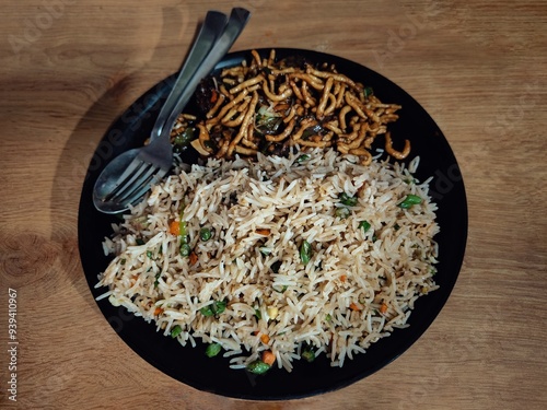 Chinese Veg fried rice in a dish with noodles, indo chinese dish served over a wooden background