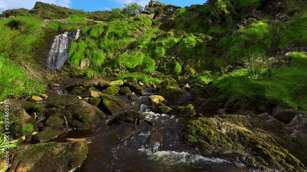 Irish spring waterfall green rocky sunny day lush green Irish spring waterfall green rocky sunny day lush green