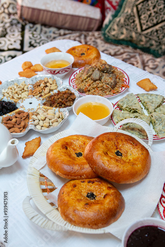 Meal with traditional Kyrgyz dishes served in the yurt. Local food in Kyrgyzstan. photo