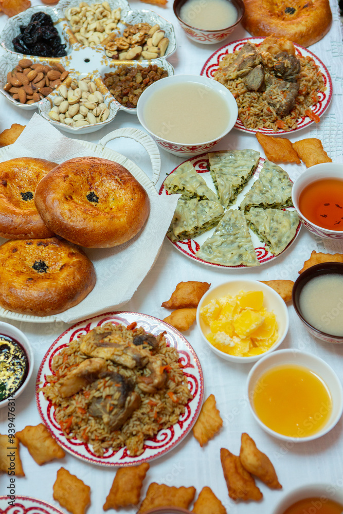 Meal with traditional Kyrgyz dishes served in the yurt. Local food in Kyrgyzstan. Meal with traditional Kyrgyz dishes served in the yurt. Local food in Kyrgyzstan.
