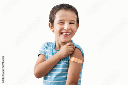 Portrait, happy and kid with plaster in studio isolated on a white background.Face, smile and boy child with bandage after vaccine, injury or wound for healthcare, first aid and excited photo