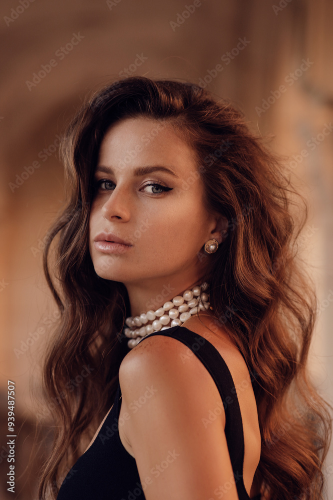 beautiful woman with dark long hair in elegant clothes with accessories posing in classic villa beautiful woman with dark long hair in elegant clothes with accessories posing in classic villa