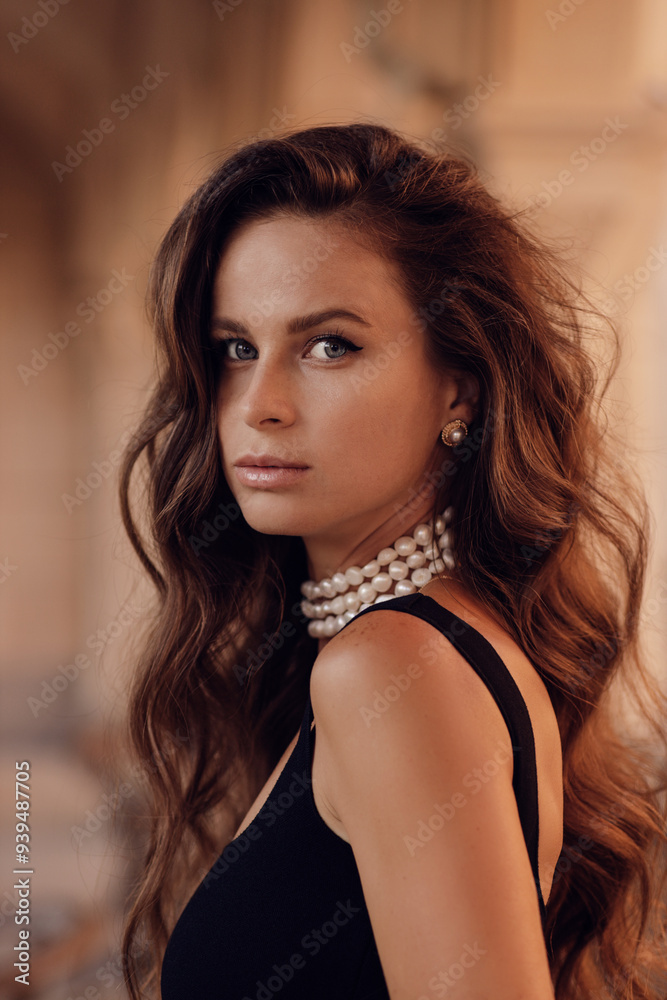 beautiful woman with dark long hair in elegant clothes with accessories posing in classic villa beautiful woman with dark long hair in elegant clothes with accessories posing in classic villa
