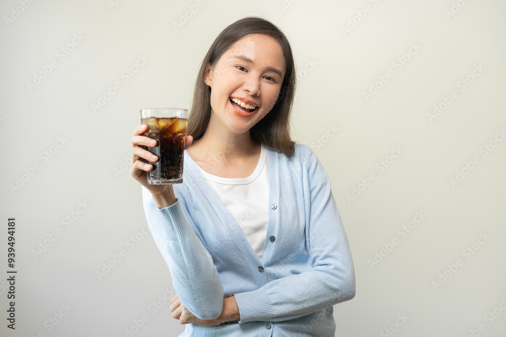 Thirsty, attractive asian young woman, happy girl drink or sip, holding a glass of cold sparkling water with ice in hand, refreshness people, isolated on background. Temptation of food, health care. Thirsty, attractive asian young woman, happy girl drink or sip, holding a glass of cold sparkling water with ice in hand, refreshness people, isolated on background. Temptation of food, health care.