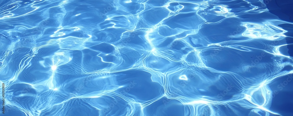 Abstract background of rippling blue water with sunlight reflecting off the surface. Abstract background of rippling blue water with sunlight reflecting off the surface.