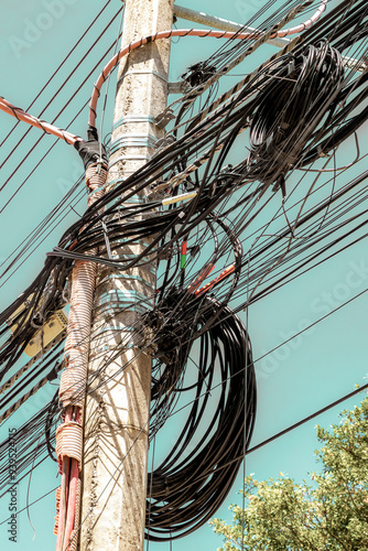 Absolute cable chaos on mexican power pole in Mexico. photo