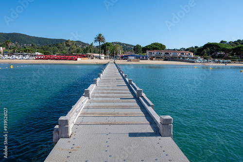 Morning view on crystal clear blue water of Plage du Debarquement white sandy beach near Cavalaire-sur-Mer and La Croix-Valmer, summer vacation on French Riviera, Var, France