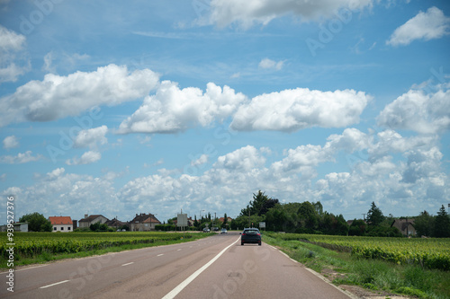 Driving in summer on RN7 free road, with view on green vineyards of Cote d Or in Burgundy near Dijon, transportation and traffic photo