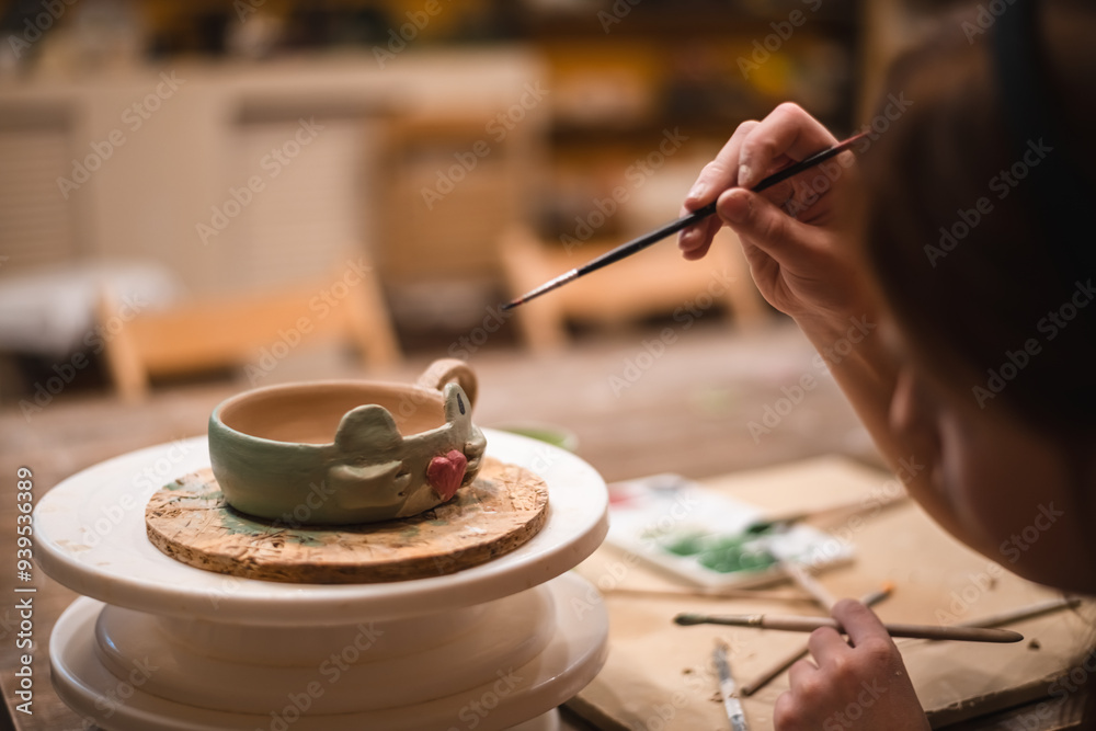 Obraz premium girl hands, pottery studio and painting cup in workshop for sculpture