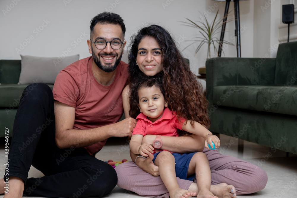 Indian Young Family Enjoying Playtime with Toddler Indian Young Family Enjoying Playtime with Toddler