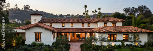 Spanish-style villa with tiled roof and terracotta walls photo