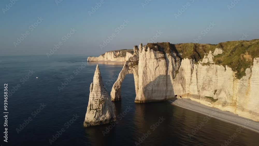 Discover the breathtaking cliffs of Etretat at sunrise over the ocean Discover the breathtaking cliffs of Etretat at sunrise over the ocean