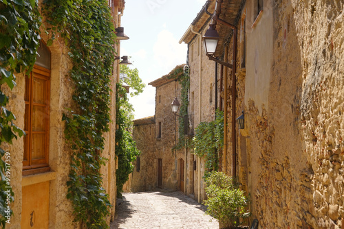 Peratallada, historic centre with small alleys and medieval Romanesque buildings at at a sunny day with blue sky, Pals, Begur, Girona, Catalonia, Costa Brava, Spain