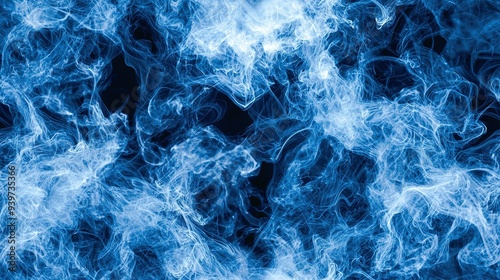  A close-up of blue smoke on a dark background with lots of visible smoke emanating from it