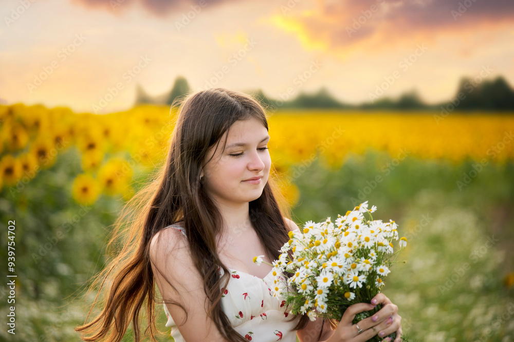 cute teenage girl with long hair and a bouquet of daisies in her hands on a blooming meadow on a summer evening. Gentle portrait
cute teenage girl with long hair and a bouquet of daisies in her hands on a blooming meadow on a summer evening. Gentle portrait