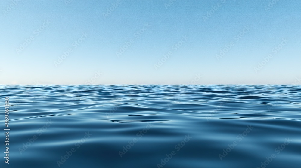A vast expanse of bluish water surrounded by a cloudless blue sky A vast expanse of bluish water surrounded by a cloudless blue sky