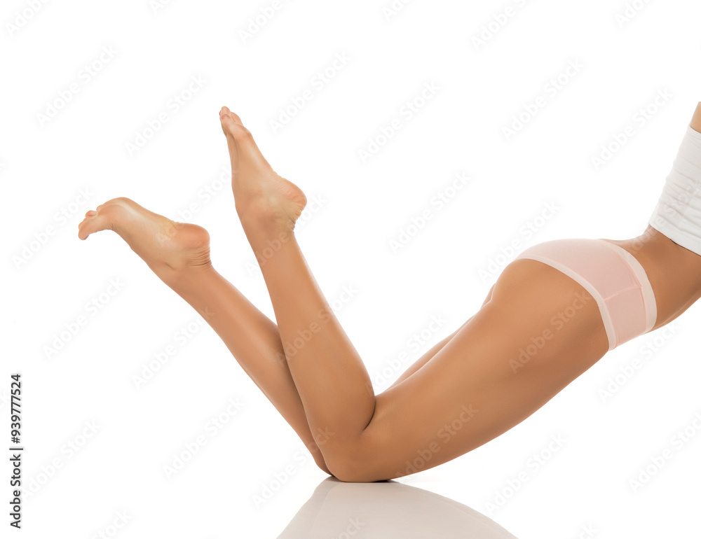 Legs, feet and skin with beauty and woman in underwear, epilation and glow on white studio background.  wellness with laser hair removal, waxing and dermatology with cosmetic skincare.