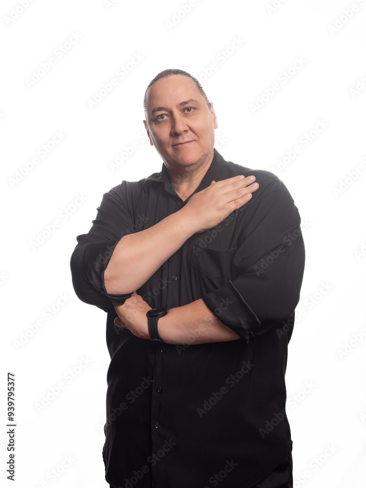 Adult man, an adult man in black clothing in front of a white background, selective focus. Adult man, an adult man in black clothing in front of a white background, selective focus.